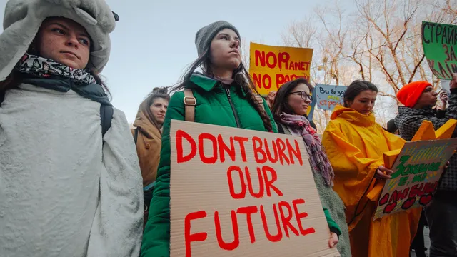 Youth Climate Strikers in the Ukraine carrying signs with climate slogans.