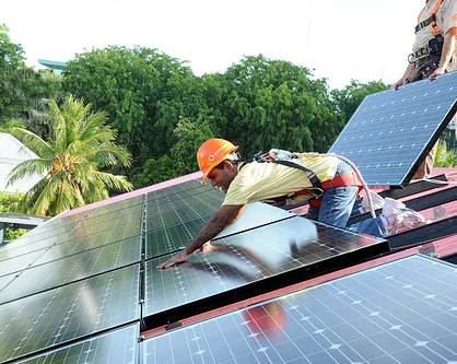 During the installation of solar panels on the presidential residence in the Maldives, in 2010. Photo: Mohammed Ali