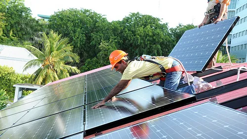 During the installation of solar panels on the presidential residence in the Maldives, in 2010. Photo: Mohammed Ali