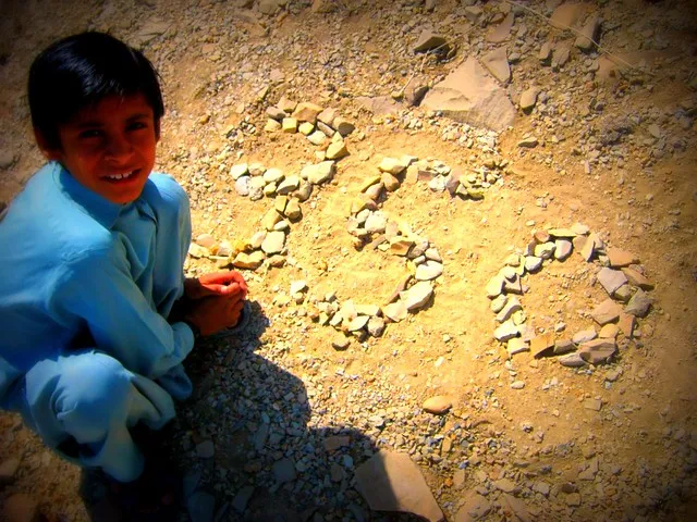 A young boy in Pakistan gets ready for his 