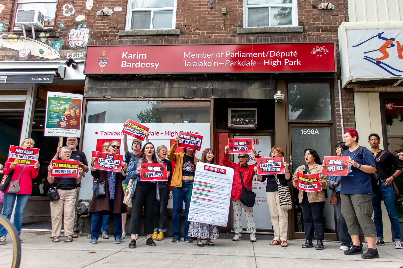 People's MOU Day of Action participants outside their MP's office in Taiaiako'n-Parkdale-High Park
