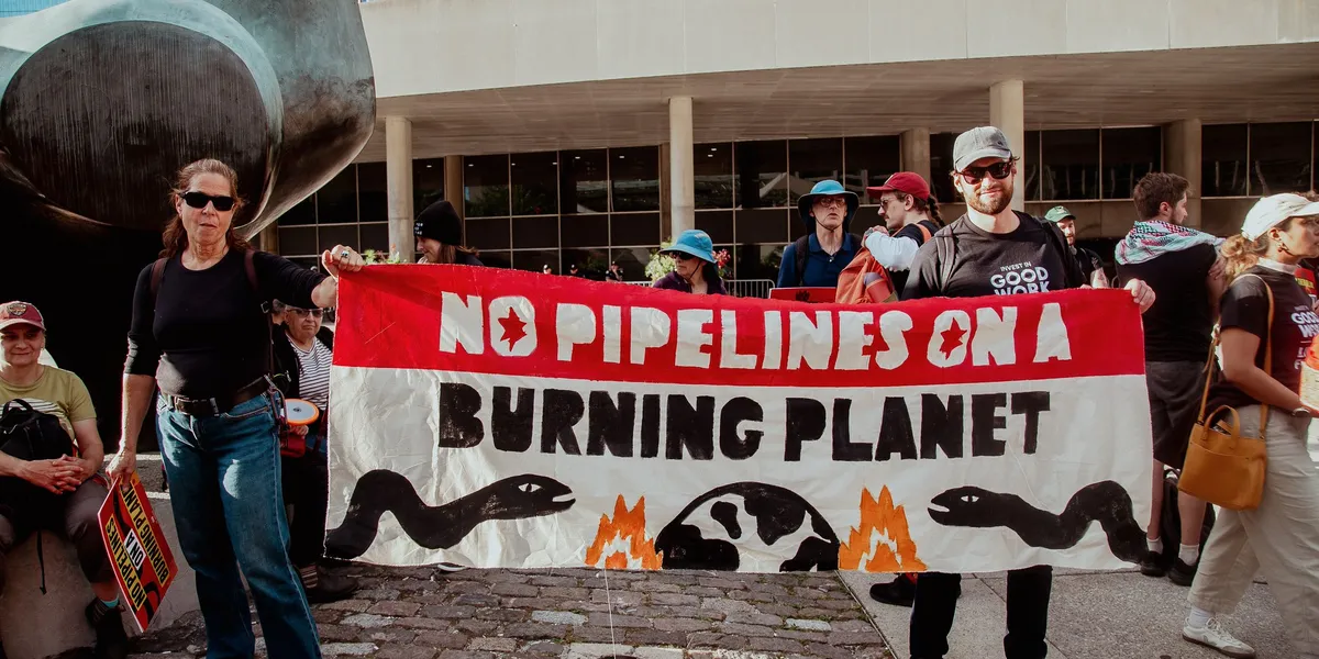 Demonstrator with No Pipelines on a Burning Planet Banner