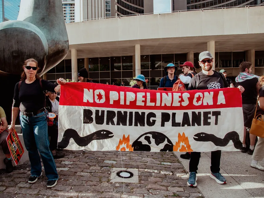 Demonstrator with No Pipelines on a Burning Planet Banner