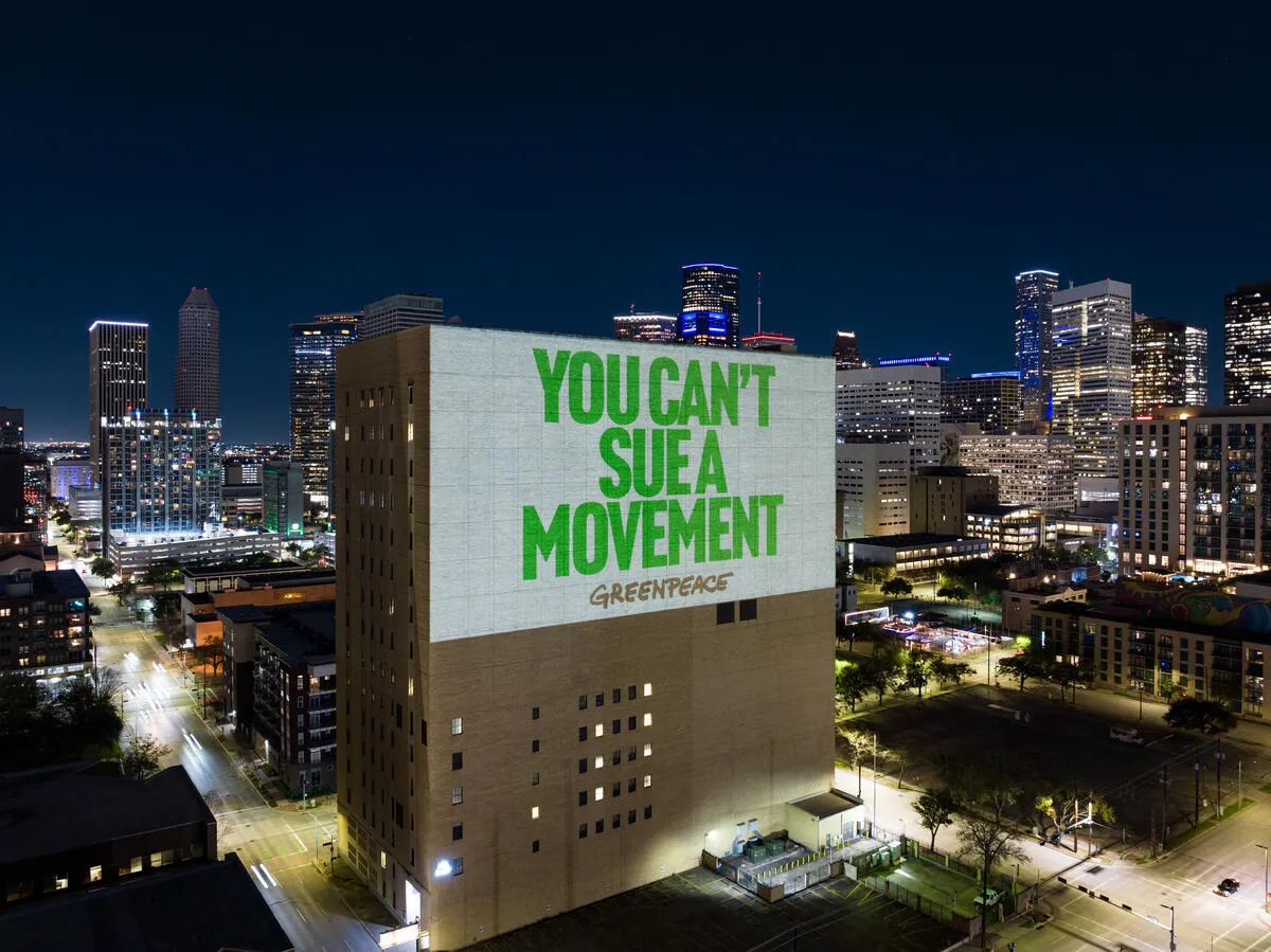 SLAPP 'We Will Not Be Silenced' Projections in Houston. © Greenpeace