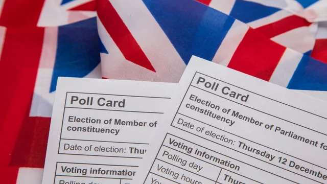 Election voting poll papers on top of UK flags