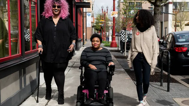 Disabled_BIPOC_strolling_down_street-scaled.jpg