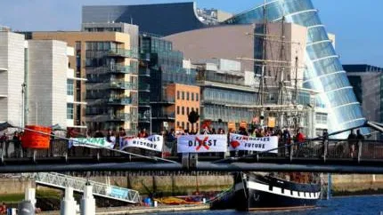 Divest-banners-outside-irish-parliament-430x286.jpeg