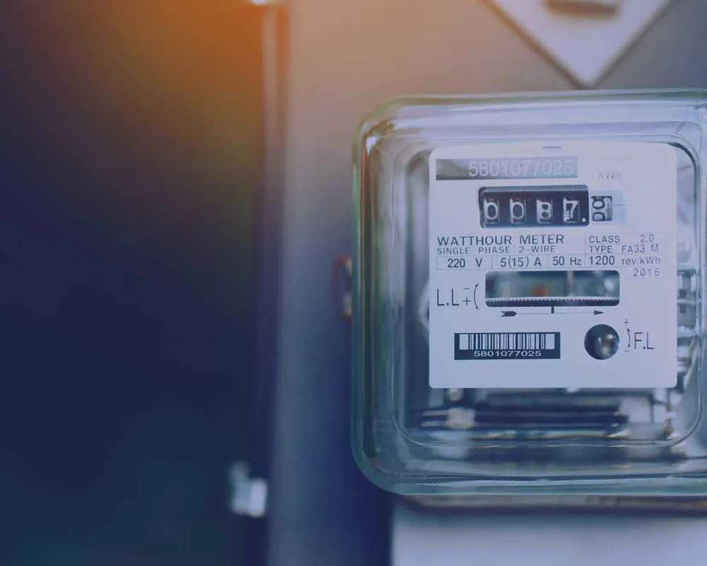 An energy meter lit from above.