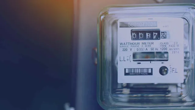 An energy meter lit from above.