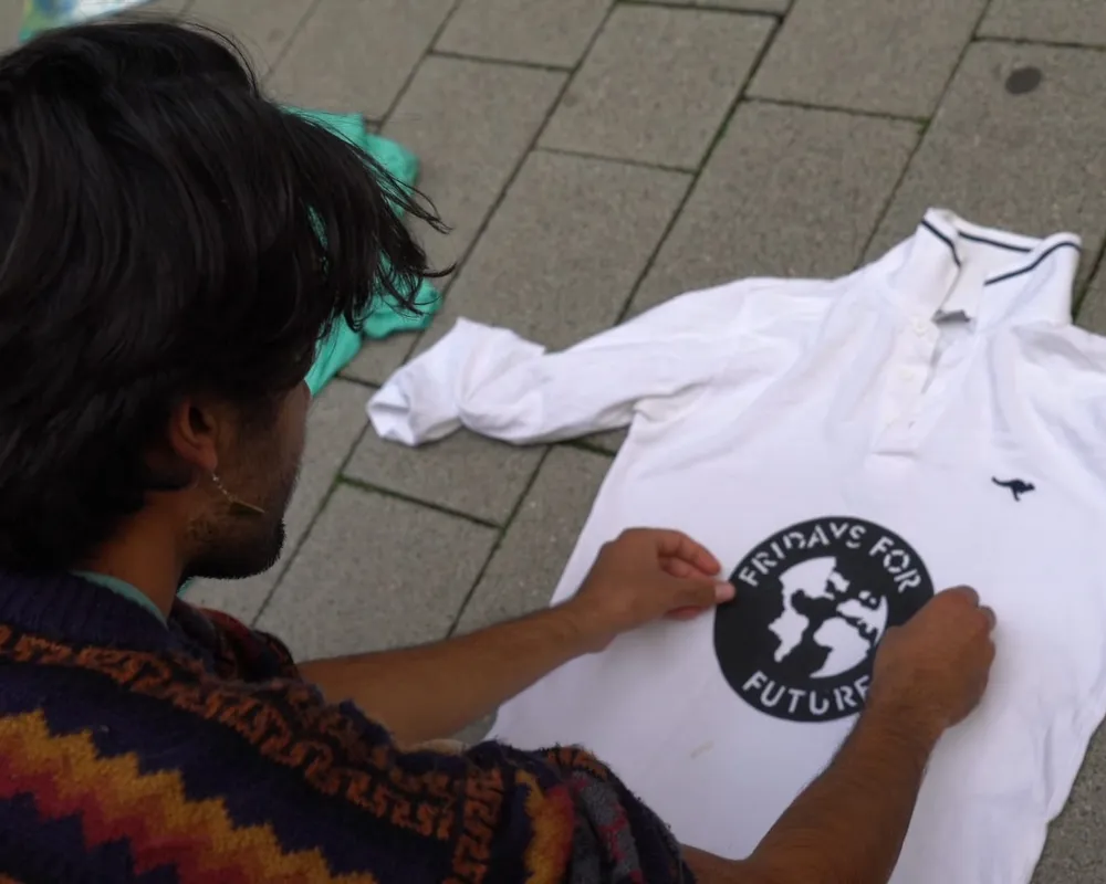 youth climate organiser shayli from germany makes fridays for future t-shirts ahead of the global climate strike