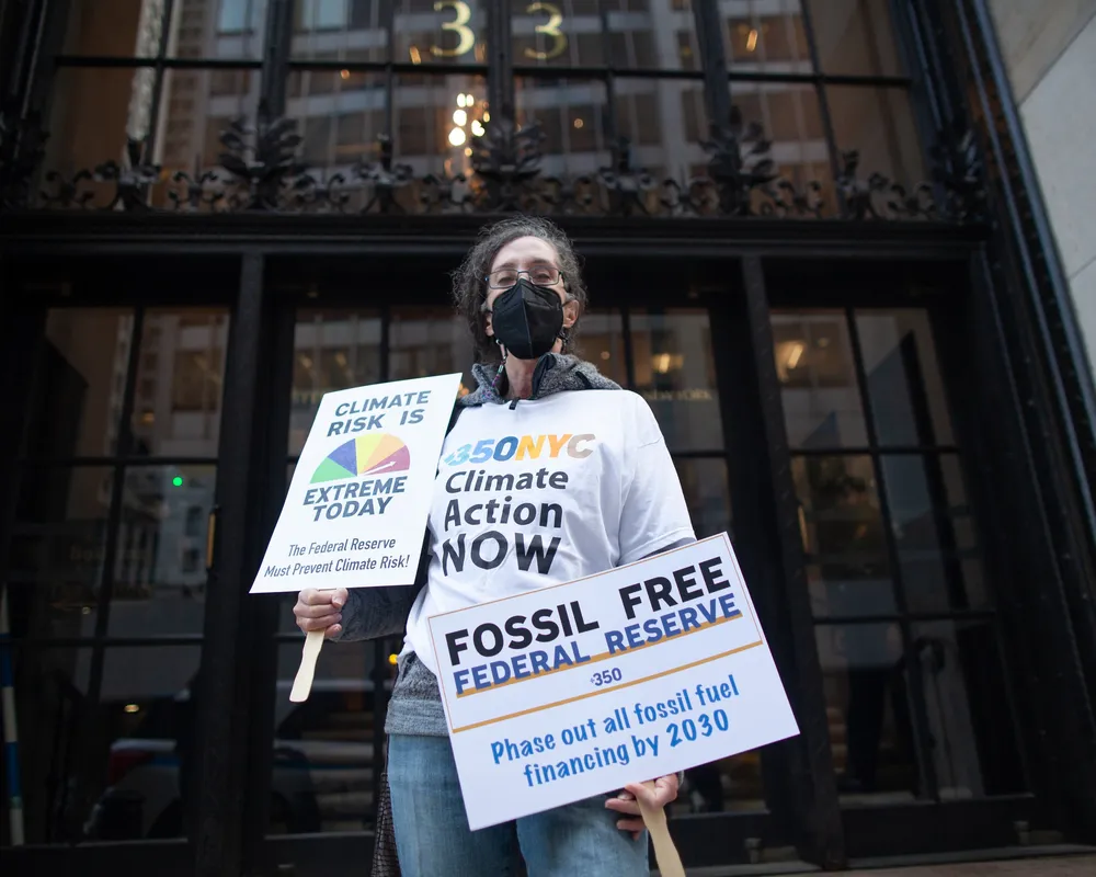 Climate activist outside of the Federal Reserve in NYC
