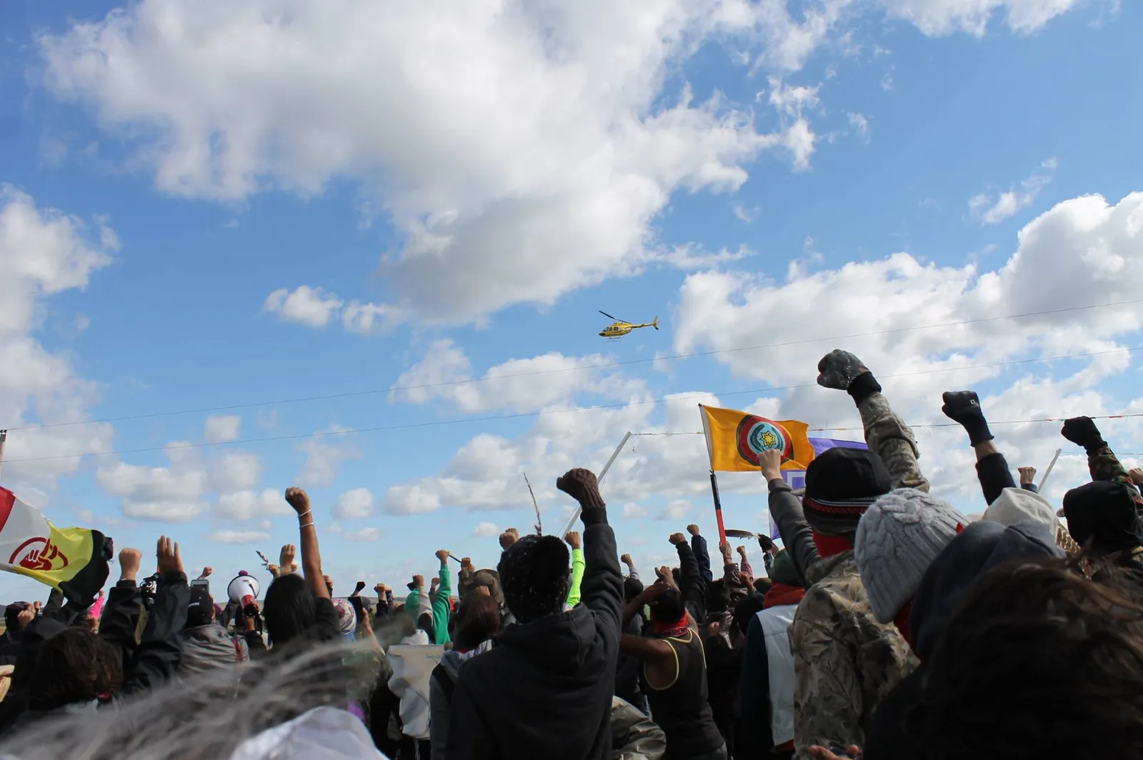 Surveillance helicopter flies overhead. Photo by: Hartman Deetz