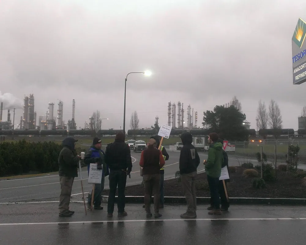 Members of Rising Tide Seattle and 350 Seattle bring food and lend support to striking workers in Anacortes, WA
