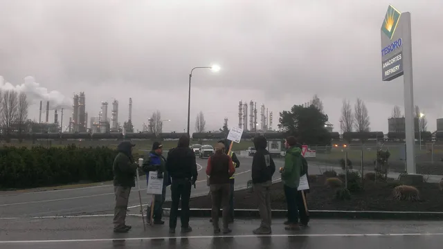 Members of Rising Tide Seattle and 350 Seattle bring food and lend support to striking workers in Anacortes, WA