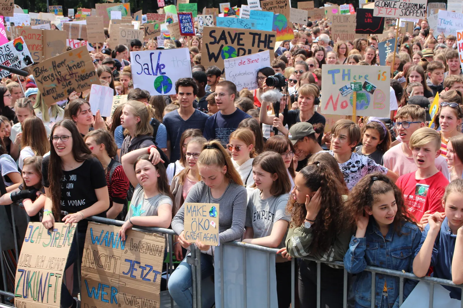 Youth school strikers in Berlin, Germany carrying placards with climate slogans