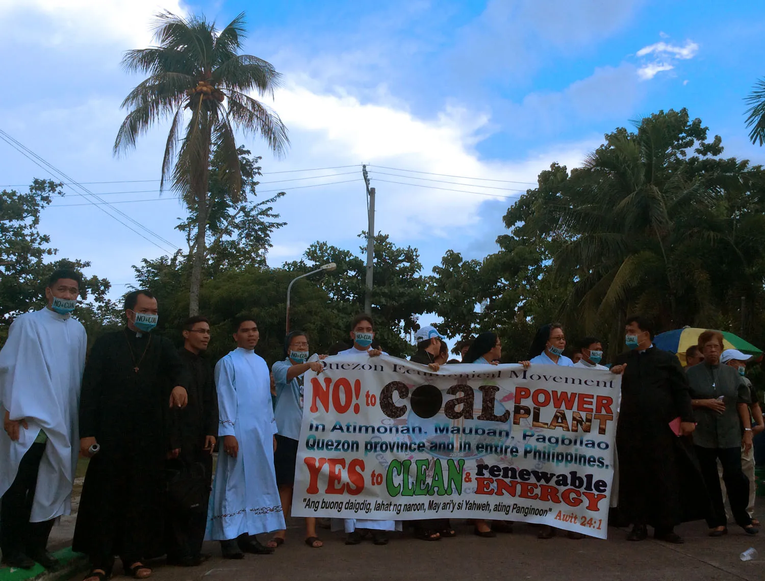 Members of clergy in the protest have their photos taken by members of the media, before heading back to Sacred Heart College, for the Mass.