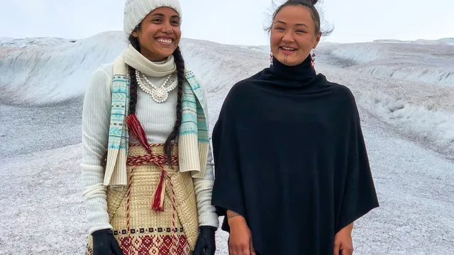portrait of two women smiling standing next to each other