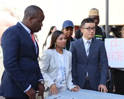 Masayoshi of 350 Japan and other delegates at a civil society event at COP27