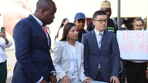 Masayoshi of 350 Japan and other delegates at a civil society event at COP27