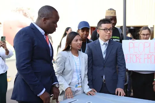 Masayoshi of 350 Japan and other delegates at a civil society event at COP27