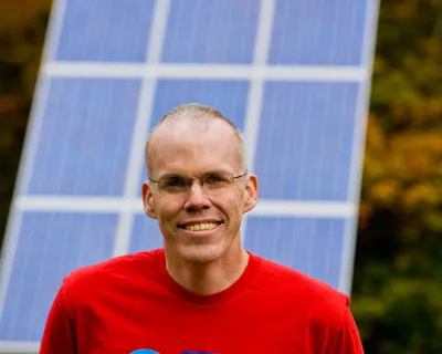 Bill McKibben in front of Solar Panels