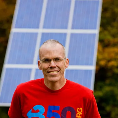 Bill McKibben in front of Solar Panels