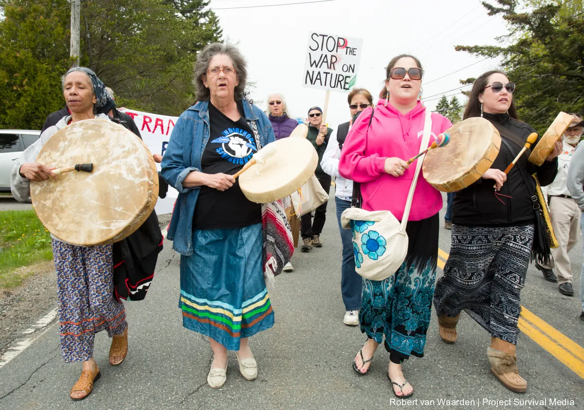 First Nations singers lead the Red Head March.