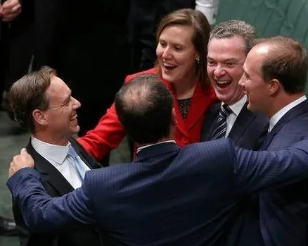 Australia's Coalition Members of Parliament celebrating the carbon repeal bills passing the House of Representatives.