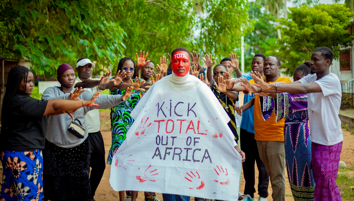 A street show condemning TotalEnergies operations in the continent by activists in Benin during the Kick Total Out Of Africa Week of Action. Photo: 350.org