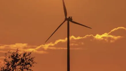 Wind turbine at sunset