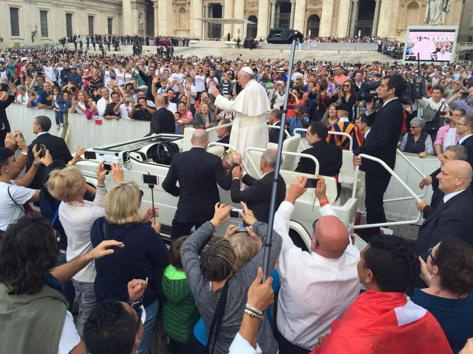The Popes guard recieves it and puts it in the car