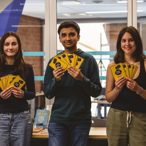 Toxic Trivia people holding cards