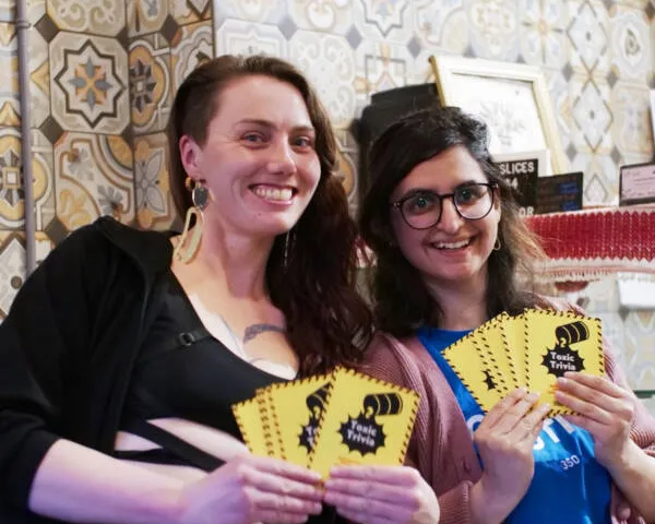 Toxic Trivia game day - two people holding cards