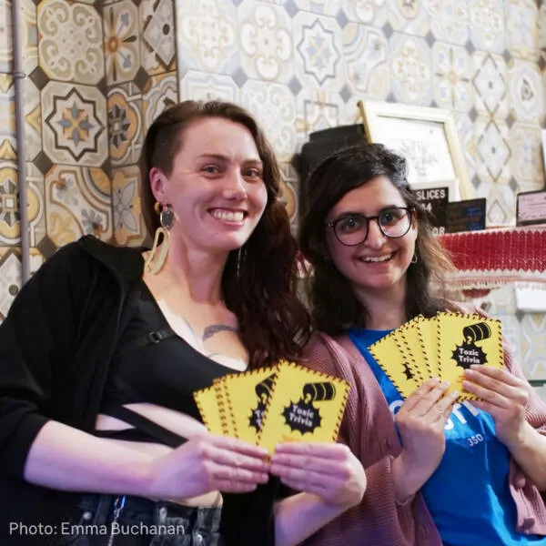 Toxic Trivia game day - two people holding cards