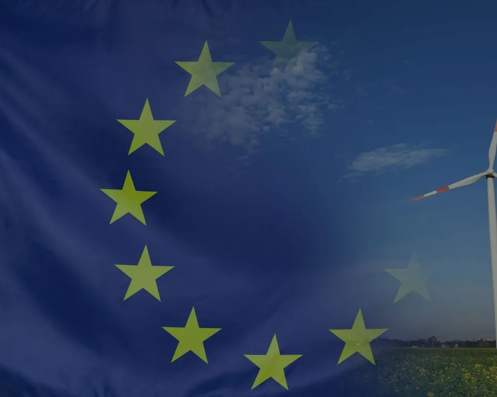 EU flag superimposed over a picture of a wind turbine