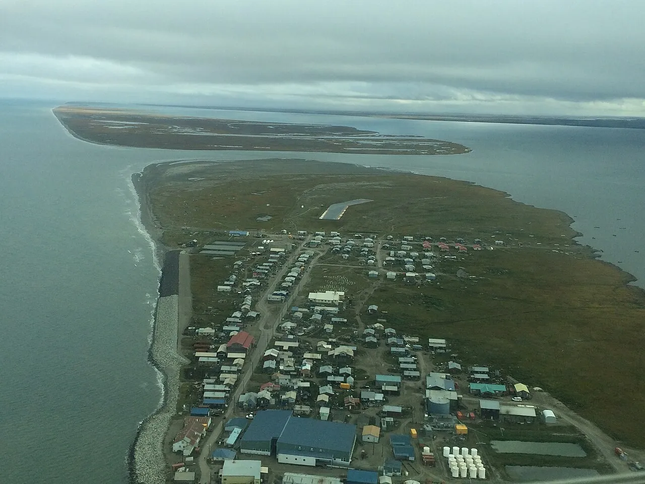 The village of Shishmaref, Alaska which confronts the daily realities of a changing climate, including repetitive flooding. The village is a subject of study by Elizabeth Marino, an anthropologist at Oregon State University - Cascades.