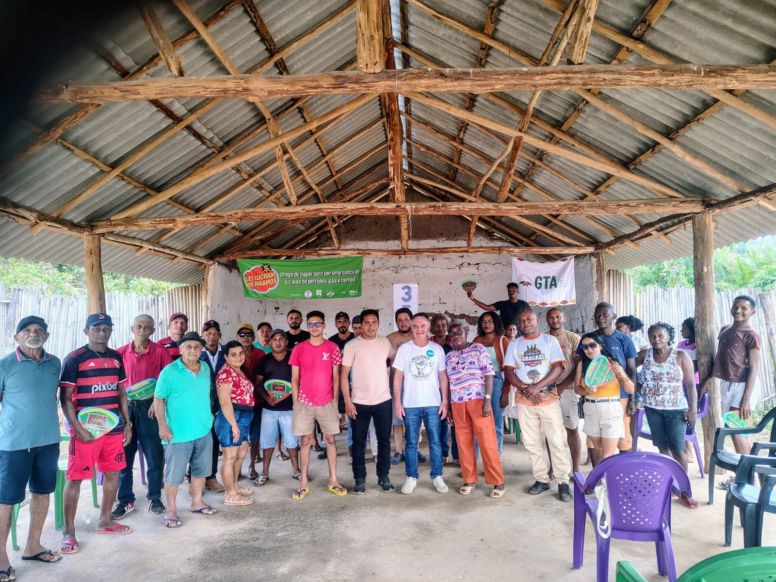 Community members gather under a covered shelter in Maranhão, Brazil, to organize against oil and gas extraction on their Indigenous lands.