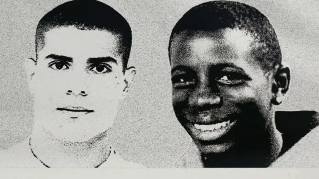 TO GO WITH AFP STORY BY EVE SZEFTEL (FILES) - A picture taken on November 4, 2006 in Clichy-sous-Bois, northern Paris, shows a giant picture of Zyed (L) and Bouna, the two teenagers whose death led France in 2005 to a nationwide wave of riots, on the side