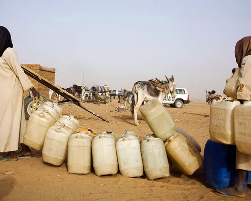 12 May 2010. Abu Shouk: Water point in Abu Shouk IDP Camp. 84.000 people collect water everyday from the only water point in the area. Each family has de right to collect water twice per week with, as maximum, 15 recipients of 8 liters each. They pay only