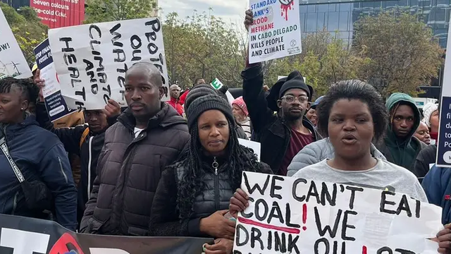 People gather outside Standard Bank in Johannesburg