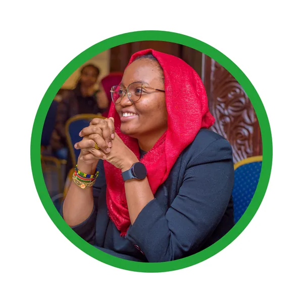Portrait of Rukiya Khamis smiling.
