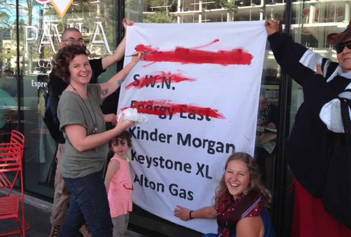People celebrating the nail in the coffin for Energy East, Canada.