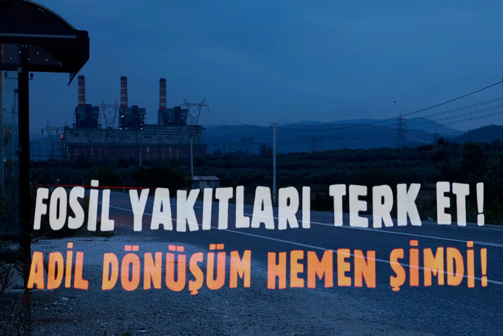 Activists hold a light painting protest displaying the message 'Break free from fossil fuels, just transition now!,  İzmir, Türkiye. Photo: Servet Dilber