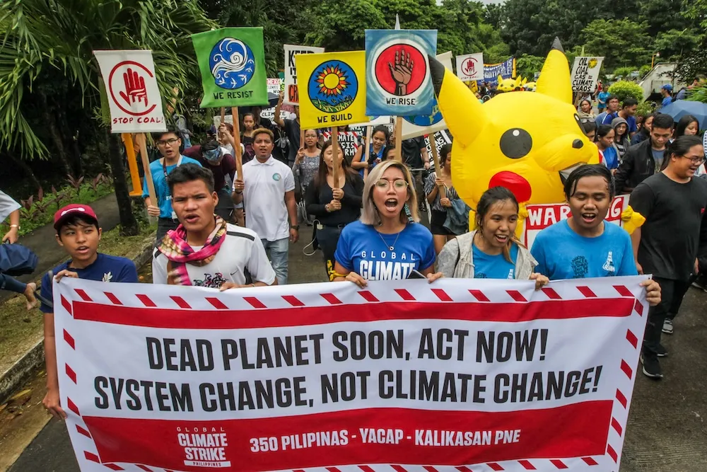 Mitzi Jonelle Tan and other youth activists march as part of the global Climate Strikes, Quezon City, Philippines. Photo: AC Dimatatac, Leo Sabangan, Dino Damar