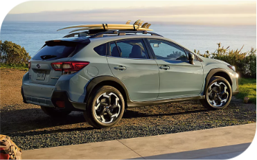 Outdoor, full-body shot of Crosstrek parked.