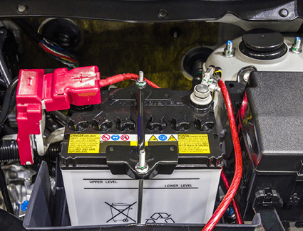 Picture of a car battery securely clamped in place