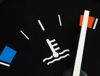 Engine heat gauge with needle in the red