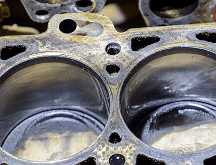 The carbon deposits shown here are less likely to form inside your engine when you use Top Tier Gas