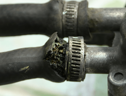 This coolant hose is fraying, and could start to leak coolant soon if it's not replaced