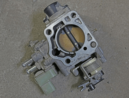 The throttle body of your car is controlled by the gas pedal, or manipulated directly by the cruise control system